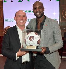 Carlton Cole, West Ham Legend (right) presenting some of the 25 prizes at EVA Air’s Evening Reception. 