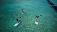 Claire, Dhafy, and Saazu practicing for their expedition