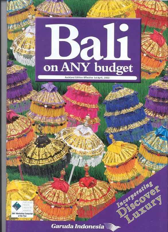 The colourful Bali on ANY budget 2002/3 brochure features ceremonial Balinese umbrellas