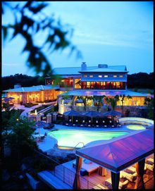 At dusk, Lakefouse Spa at Lake Austin Spa Resort glows with warmth.