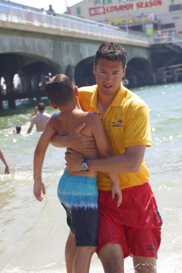 Lifeguard Saving Child