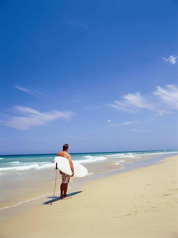Surfing On A Beach In Queensland