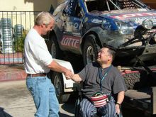 Yukiya Watanabe shakes hands with one of his sponsors