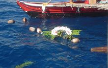 A wreath and coconuts were laid at sea above the SMS Cormoran