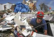 Rescue services looking for survivors. Tornado Flattens Town In Kansas