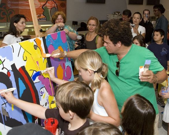 Artist Romero Britto leads the King Tut Pyramid Project Paint Party