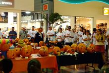 Spectators enjoy the display of creative jack-o-lanterns at the Underwater Pumpkin Carving Contest