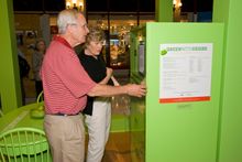 Checking out the contents and energy use facts about refrigerators, visitors to the <i>Green with Desire: Can We Live Sustainabl