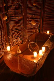 bath carved out of a tree trunk inside one of Azulik's cabanas
