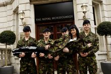 Privates Bartlett, Sinclair, Carrigan and Almond, of The Household Cavalry pose with Peta Todd, model and Help for Heroes ambass