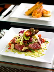 Main St. Deli - Cajun crusted Sirloin mixed leaves with Jack cheese, black eyed peas, cherry tomatoes and red peppers served wit