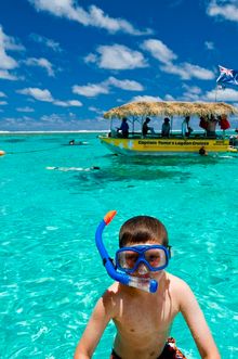 Child snorkelling Muri Lagoon, Rarotonga