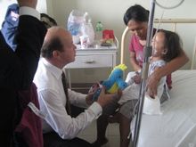Bernd Schneider attends to one of the patient after the operation 