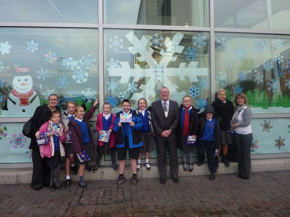 Staff and pupils from St Christopher�s Catholic Primary School join JLA�s Head of terminal Services, Dave Walsh (centre), follow