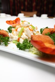 	Saut�ed sliced fresh lobster with stuffed lobster tails.jpg