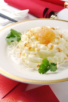 Scrambled egg white with crab meat, bird’s nest and topped with olive seed
