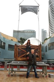 Franz Harary enter into the packing crate with Fiona Sit preparing to wow audience