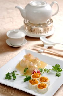 Stewed turnip rings stuffed with shrimp paste and topped with bird’s nest, accompanied by bean curd filled with shrimp paste, ha