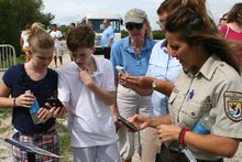 Smartphone and iPad users of all ages have fun trying out the new iNature Trail’s 11 QR-code signs at the J.N. 