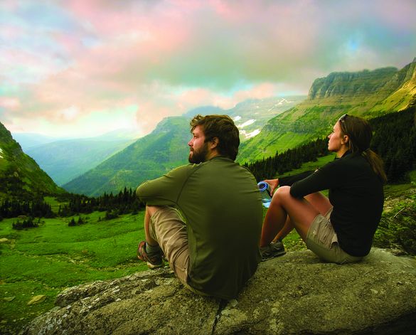 Hikers relax on Glacier National Park's Highline Trail.