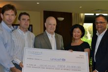 Club Melia executives present check for ,000 to UNICEF Dominican Republic Deputy Representative, Sayo Aoki.