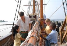 Visitors learn how to untie sails on the Discovery.