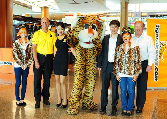 from left to right, are Campbell Wilson (CEO of Scoot), Koay Peng Yen (Tiger Airways' Group CEO) and Stewart Adams (Tiger Airway