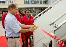 President James Michel cuts a ribbon to inaugurate the new aircraft.  