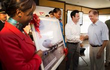 President Michel receives a token of appreciation from Air Seychelles’ Chief Executive Officer, Cramer Ball.