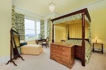 Six Large Bedrooms Can Be Found Upstairs, Each Of Which Has Impressive Views Of The Bay Or The Gardens.  Five Are Furnished With