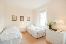 Bedroom Four Is Furnished With Two Single Beds, A Cot, A Built In Wardrobe And Bedside Table With Lamp