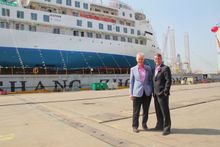Greg Mortimer and Robert Halfpenny celebrating the Greg Mortimer sea launch together