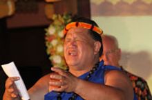 Outrigger cultural ambassador Kaipo Ho signs an official Hawaiian blessing