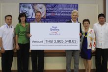 Dusit International COO, Mr David Shackleton, presents the check to Operation Smile Thailand on behalf of Dusit Smiles. From Lef