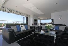 Bi-Folding Doors From The Living Room Open To The East, South And West Of The Apartment Creating Stunning Uninterrupted Views.  