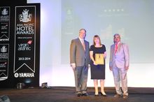 Photo shows Gillian Murphy, Senior Vice President, Non-Gaming Operation, Galaxy Macau, receiving the “Best Resort Hotel Macau” a