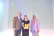 Photo shows Gillian Murphy, Senior Vice President, Non-Gaming Operation, Galaxy Macau, receiving the “Best Resort Hotel Macau” a