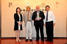 A souvenir is presented to Ambassador Nicholas Platt after his Saturday lecture at the University of Macau, sponsored by The Ven