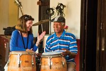 An IE guest bonds with a Cuba musician. 