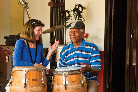 An IE guest bonds with a Cuba musician. 