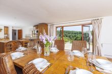 The Open Plan Kitchen And Dining Area Has Impressive Fold Back French Windows That Open Up On To The Patio, Bringing The Beauty 