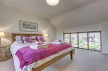 Upstairs Are Four Large Bedrooms.  The Master En-Suite Bedroom Is Furnished With A King-Size Bed, Handsome Bedside Tables With L