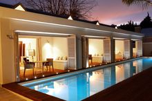The TRSH exterior evening pool suites