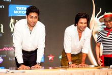 : Bollywood heartthrobs Shahid Kapoor (right) and Abhishek Bachchan (left) lay down their handprints and signatures for posterit