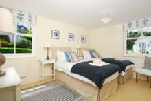 On The Lower Level, And With Direct Accessible From The Street, Are The Two Other Bedrooms.  Bedroom Two Is A Large En-Suite Wit