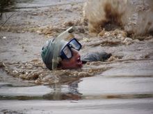 A Contestant Ploughs Through The Muddy Waters