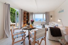  Inside The Dell, the main living area is lined with wood panelling finished with calming Farrow & Ball creams creating a cosy c