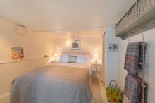 Off the main living room in The Dell lies the cosy and romantic en-suite bedroom, furnished with a good sized double bed, flanke