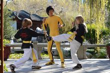 Students performing kung fu moves for Bruce Lee