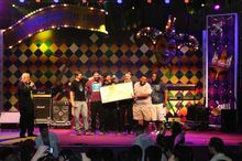 The Main Squeeze, from Indiana, USA, first place winners of last year’s Jazz & Blues contest, receive their ceremonial cheque Ma